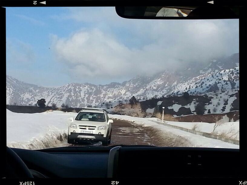 snow, winter, cold temperature, transportation, mountain, car, mode of transport, land vehicle, season, transfer print, sky, weather, snowcapped mountain, mountain range, auto post production filter, road, covering, landscape, vehicle interior, nature