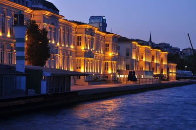 Illuminated buildings in city at night