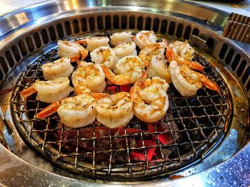 High angle view of meat on barbecue grill