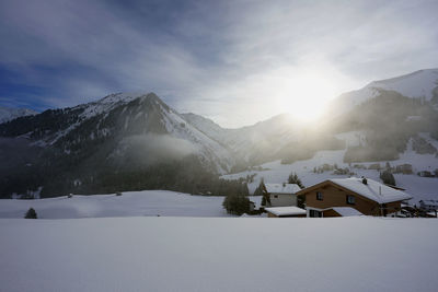 Scenic view of snow covered mountain against sky