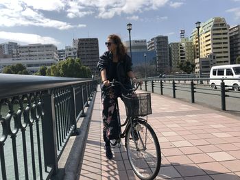 Man riding bicycle on street in city