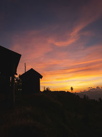 Low angle view of building against sky during sunset