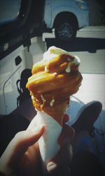 Close-up of hand holding ice cream