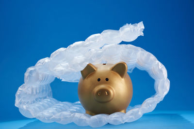 Close-up of stuffed toy against blue background