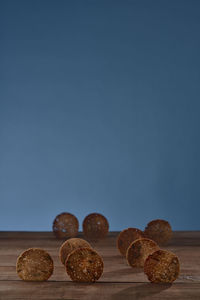 Close-up of food on table against blue background