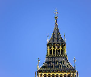 Low angle view of tower against clear blue sky