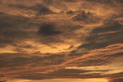 Low angle view of dramatic sky during sunset