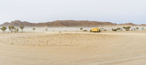 Scenic view of desert against clear sky