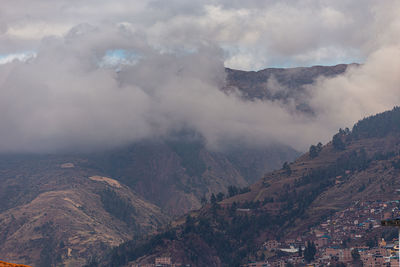 Aerial view of landscape with mountain range in background