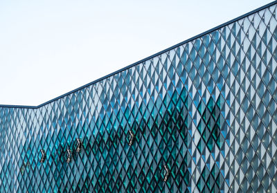 Low angle view of modern building against clear sky