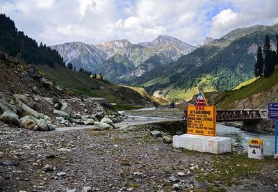 Scenic view of mountains against cloudy sky