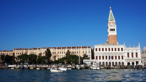 Church of san giorgio maggiore by grand canal against clear blue sky in city