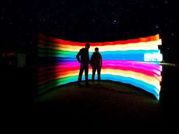 Silhouette of people at night