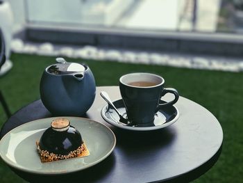 Close-up of coffee cup on table