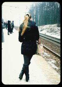 Young woman standing in park