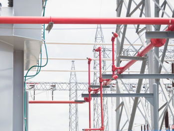 Low angle view of crane against sky