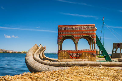 Boat on sea against blue sky during sunny day