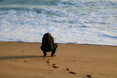 Rear view of man on beach