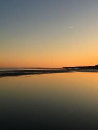 Scenic view of sea against clear sky during sunset