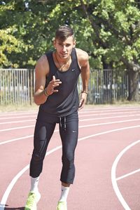 Full length of young man posing for marathon