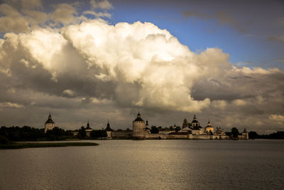 Panoramic view of city against cloudy sky