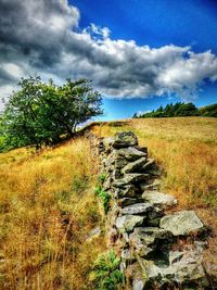 View of landscape against cloudy sky