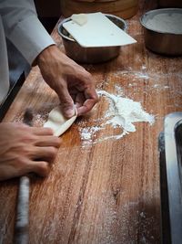 Midsection of person working on table