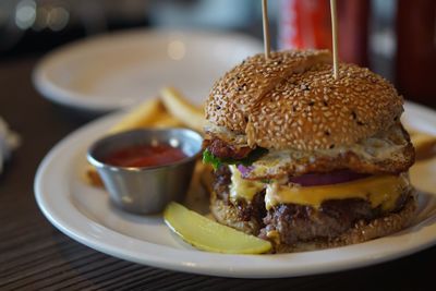 Close-up of hamburger in plate on table