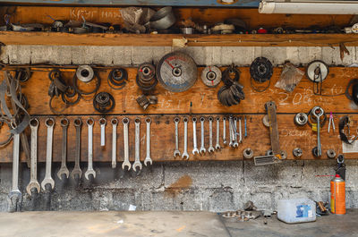 Collection of various repair tools hanging on wall. workshop with tools.