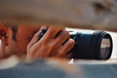 Close-up of woman photographing camera