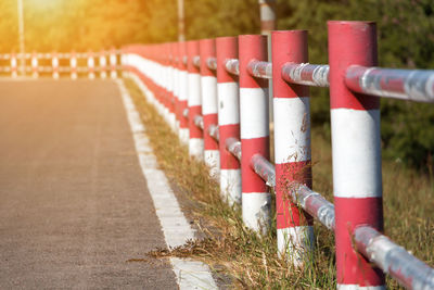 Close-up of railing by road