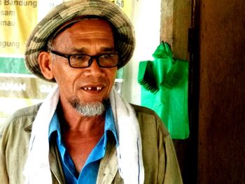 Portrait of man wearing eyeglasses