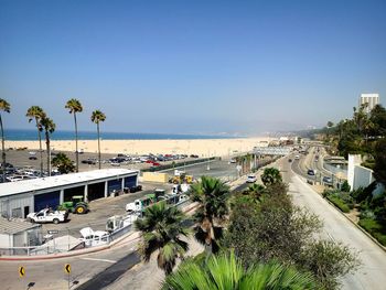 High angle view of palm trees by sea against sky