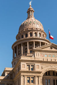 Low angle view of building against blue sky