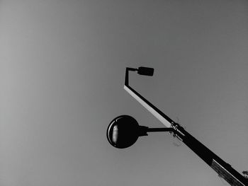 Low angle view of street light against sky