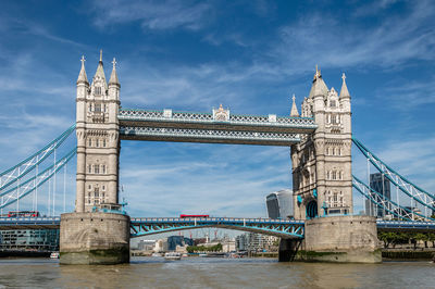 Tower bridge over thames river against sky