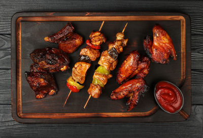 High angle view of meat on barbecue grill