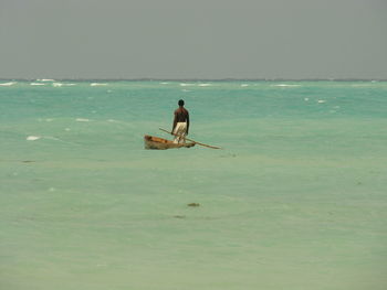 Full length of man at beach against sky