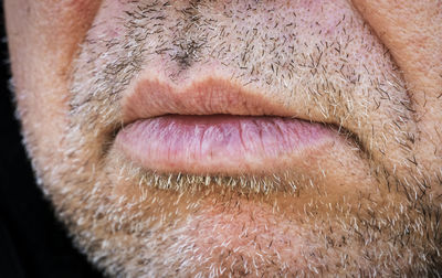 Close-up of man eye over black background