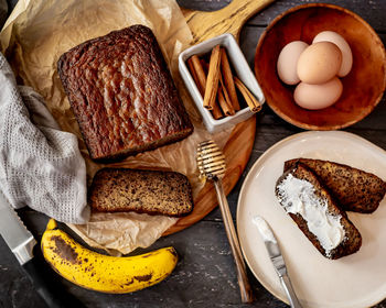 Home made banana bread rustic flat lay fresh ingredients honey eggs