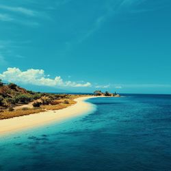 Scenic view of sea against blue sky