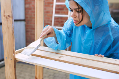 Portrait of young woman working in workshop