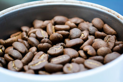 Close-up of roasted coffee beans in container