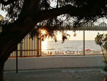 Scenic view of calm sea at sunset