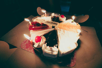 Close-up of lit candles on birthday cake