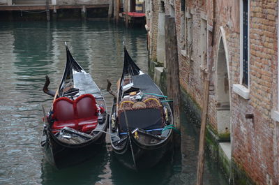 Boats moored in canal