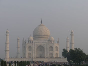 Taj mahal built by shah jahan in 1632 - 1653 bathed in sunrise yellow, agra, india 2019