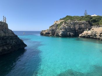 Scenic view of sea against clear blue sky