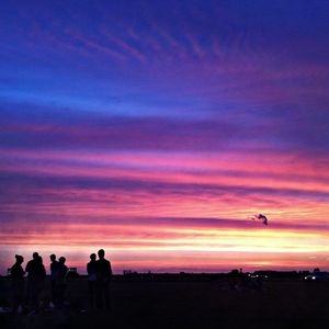 Silhouette of people at dusk