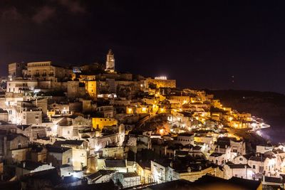 High angle view of illuminated buildings in city at night